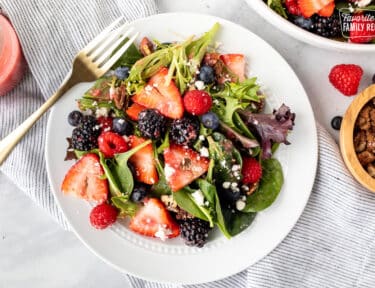 Plate with Nuts About Berries Salad and a fork.