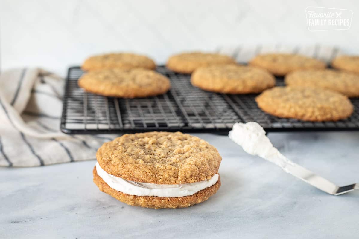 Oatmeal Cream Pie cookie next to frosting spatula.