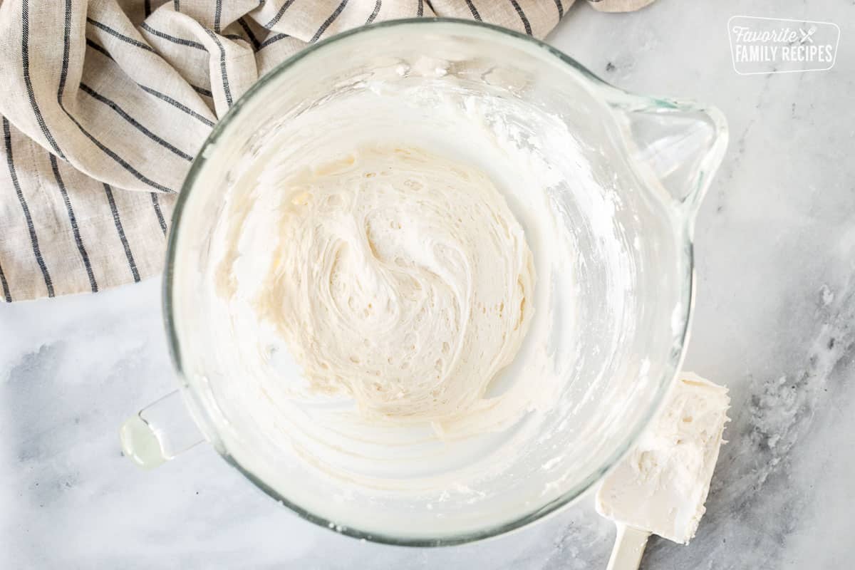 Mixing bowl with marshmallow cream frosting.