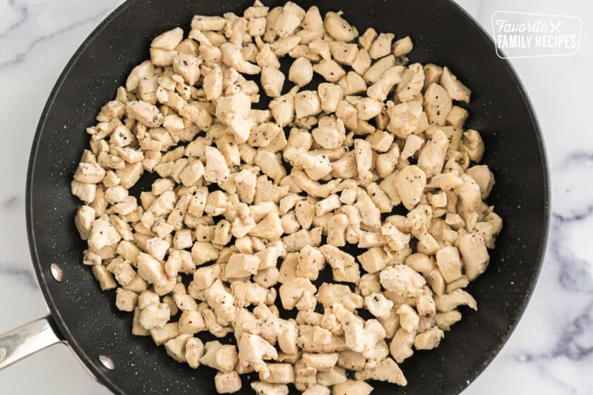 cooked diced chicken in a pan