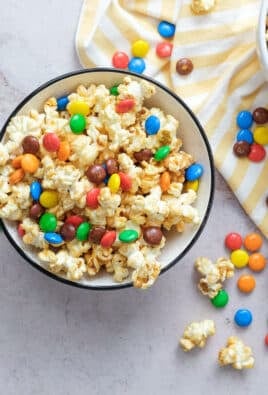 Overhead shot of two bowls of Peanut Butter Popcorn with m&m's