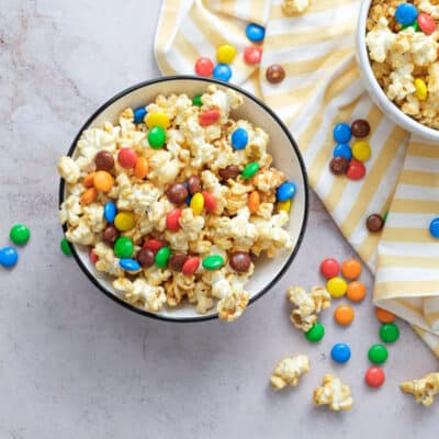 Overhead shot of two bowls of Peanut Butter Popcorn with m&m's