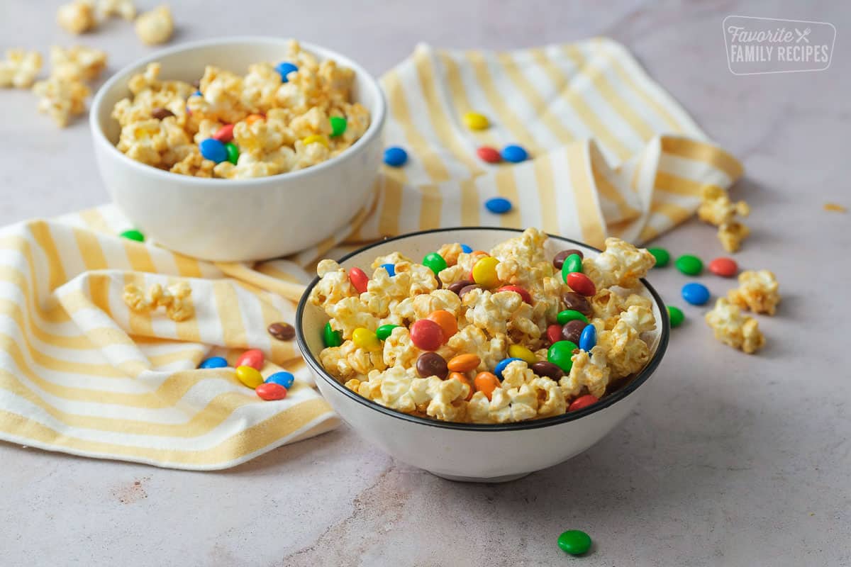 Two bowls of Peanut Butter Popcorn with m&m's