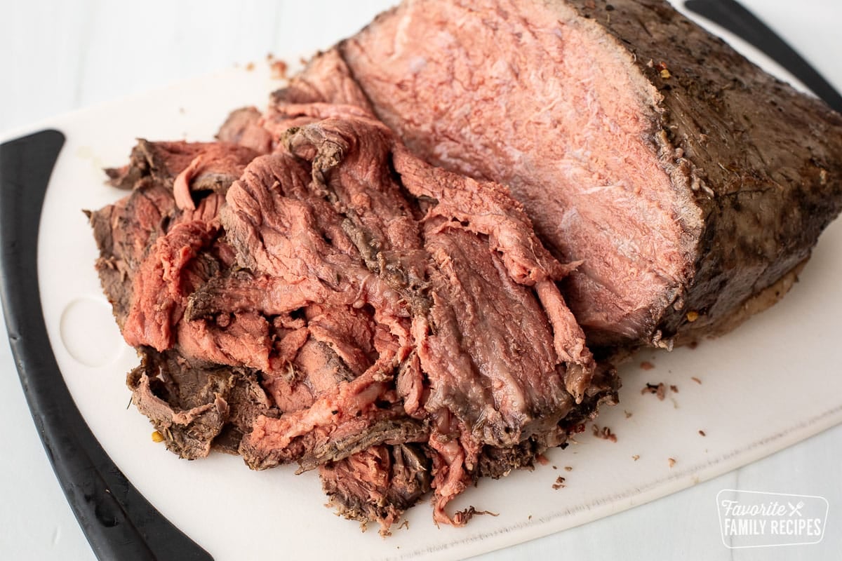 Sliced roast beef on a cutting board