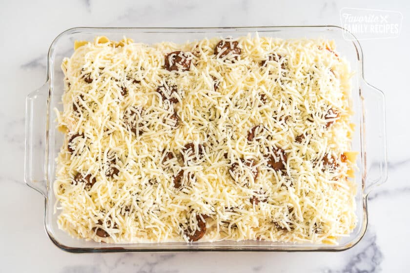 Top layer of Sausage Pasta Bake in a glass baking dish
