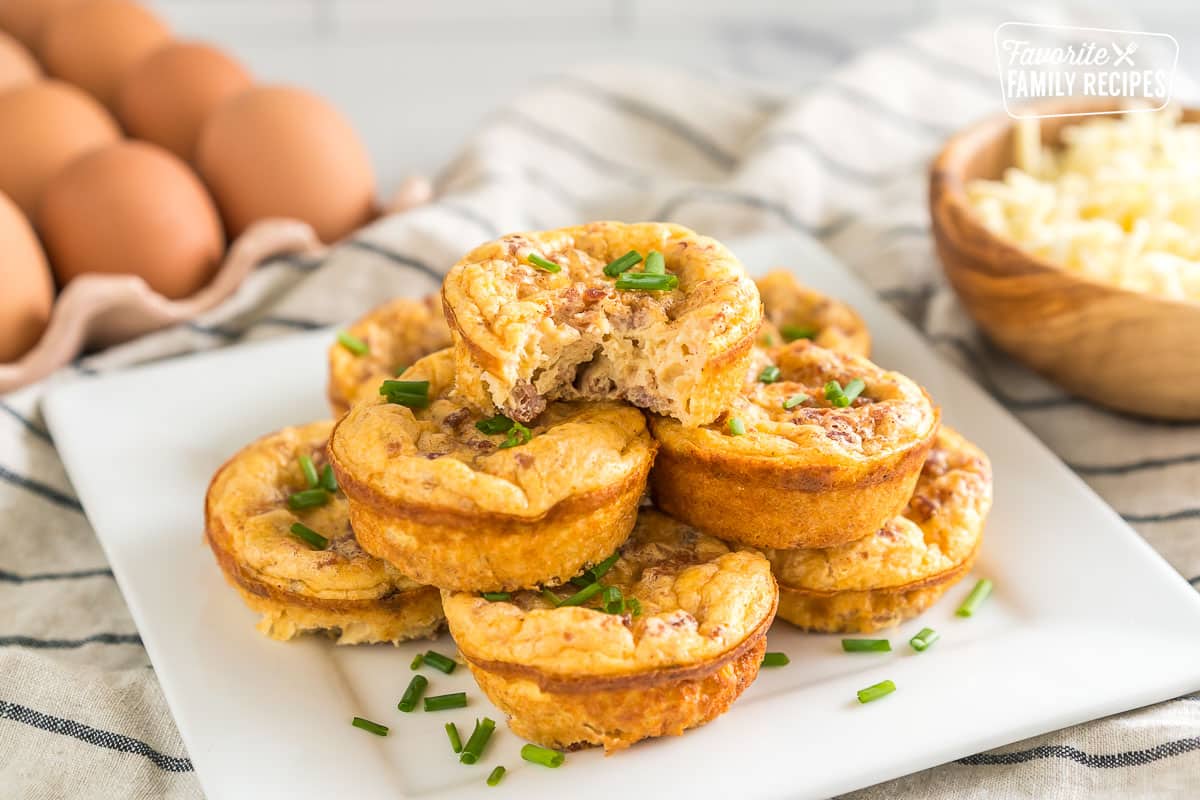 a stack of starbucks egg bites with a bite taken out of one