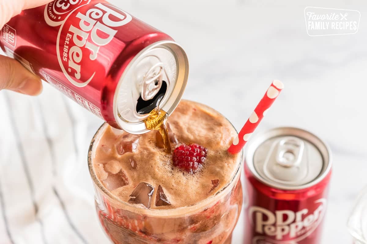 pouring Dr Pepper into a glass