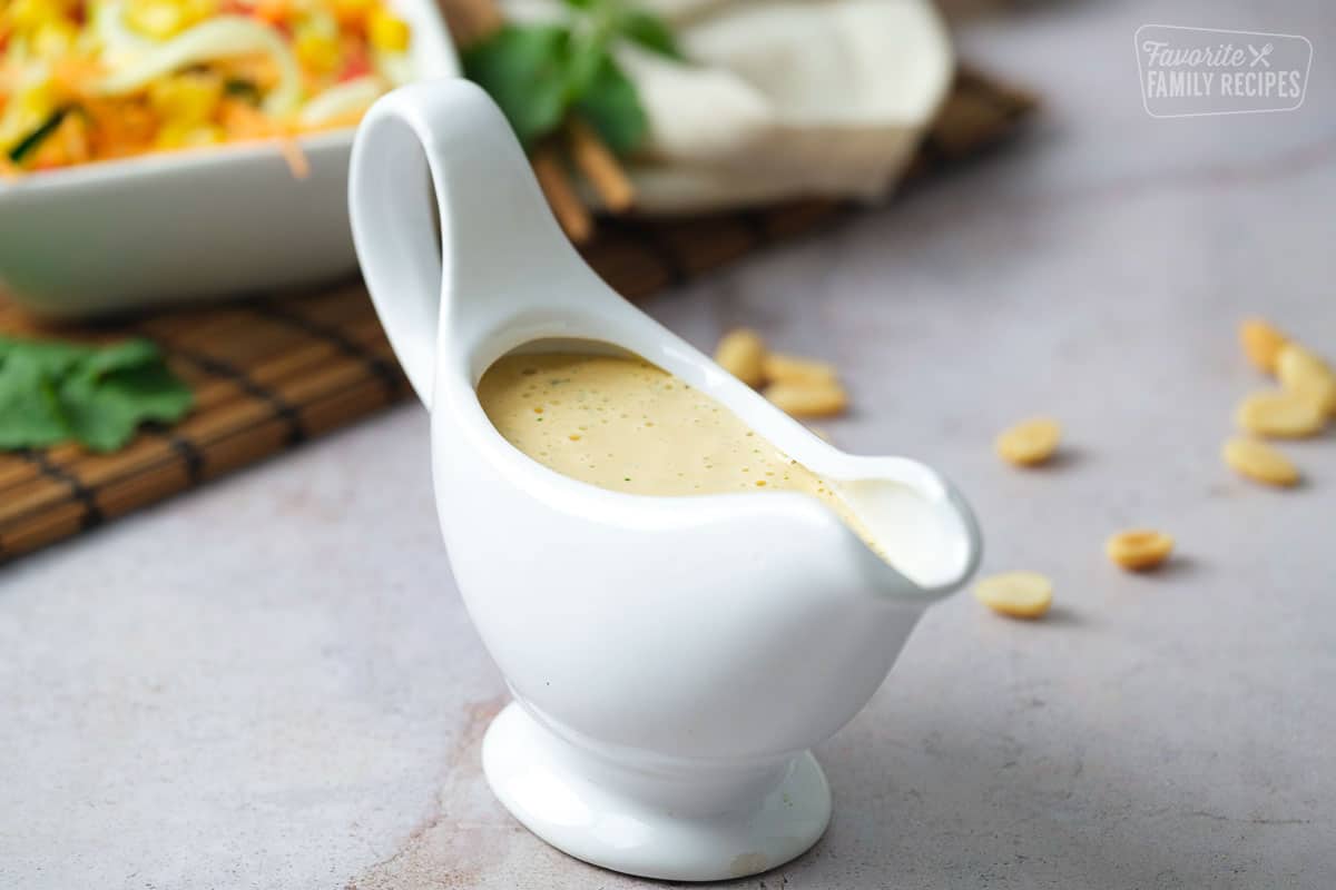 Wide angle view of Thai peanut dressing in a pouring container