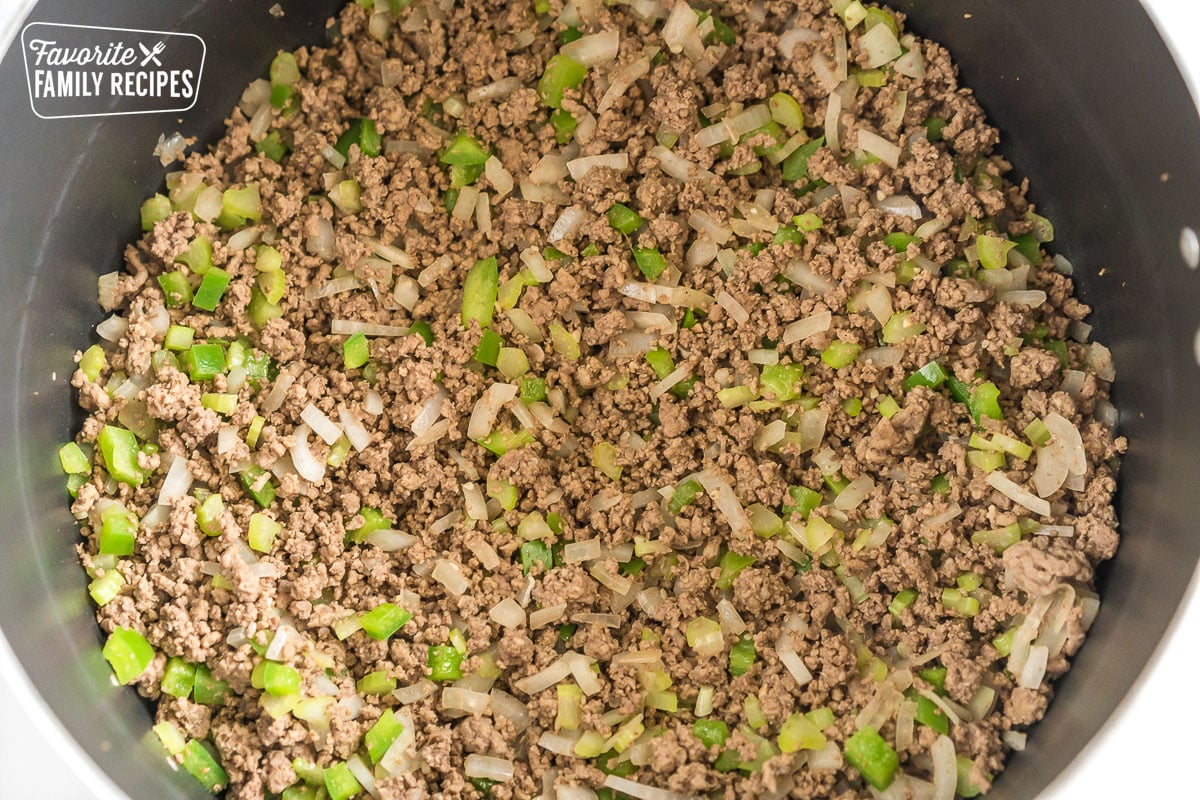 Ground beef and diced veggies in a large pot