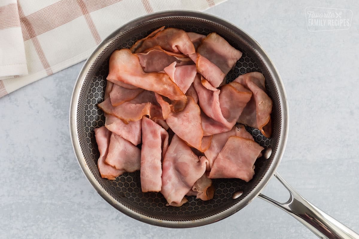 Ham cooked inside a skillet.