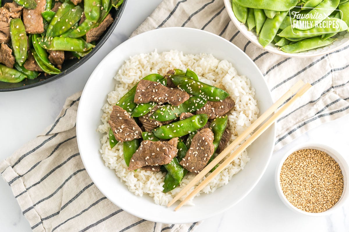 a bowl of beef and snow peas