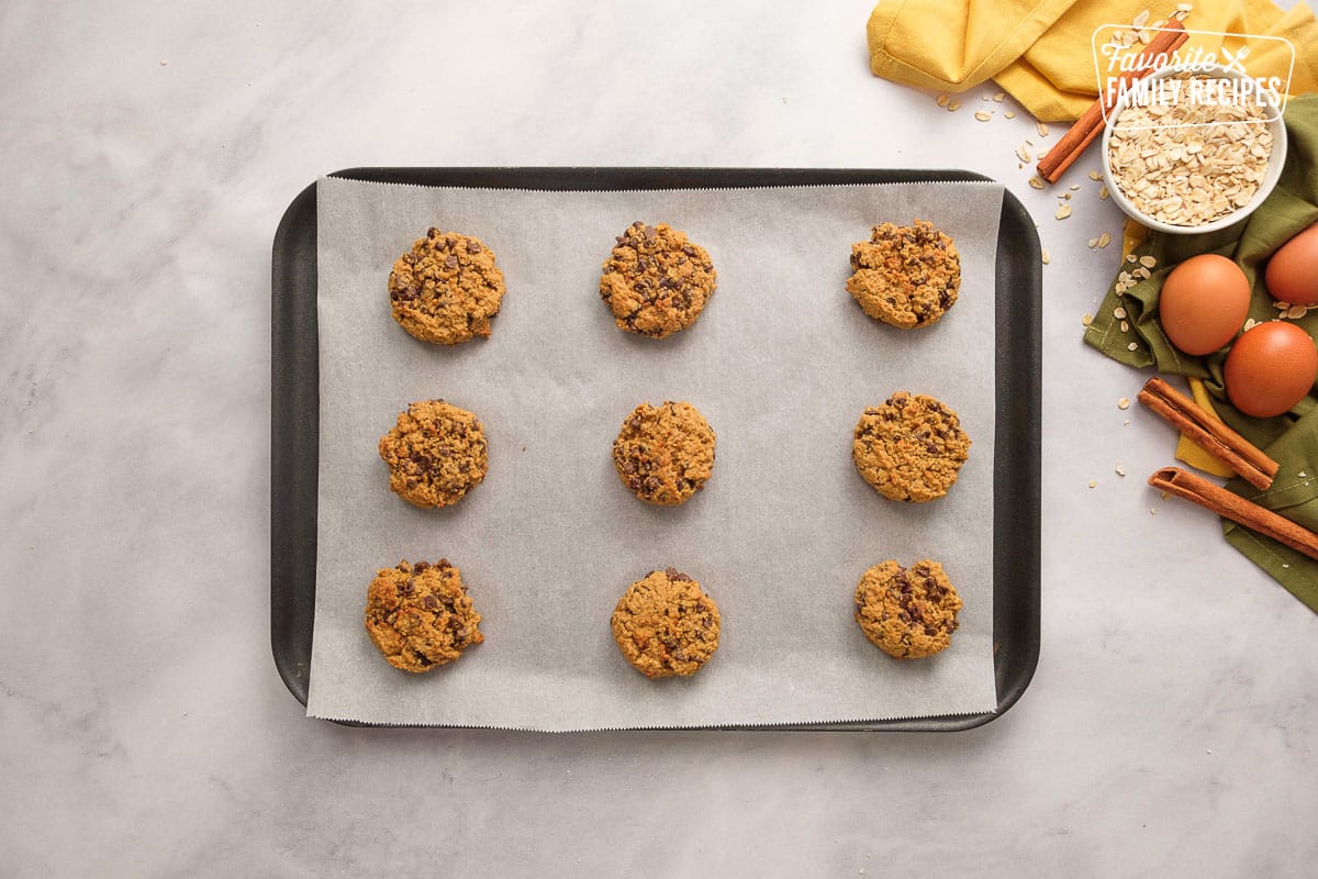 Chewy Oatmeal Cookies on a cookie sheet with liner