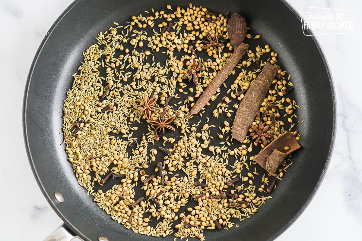 spices toasting in a skillet