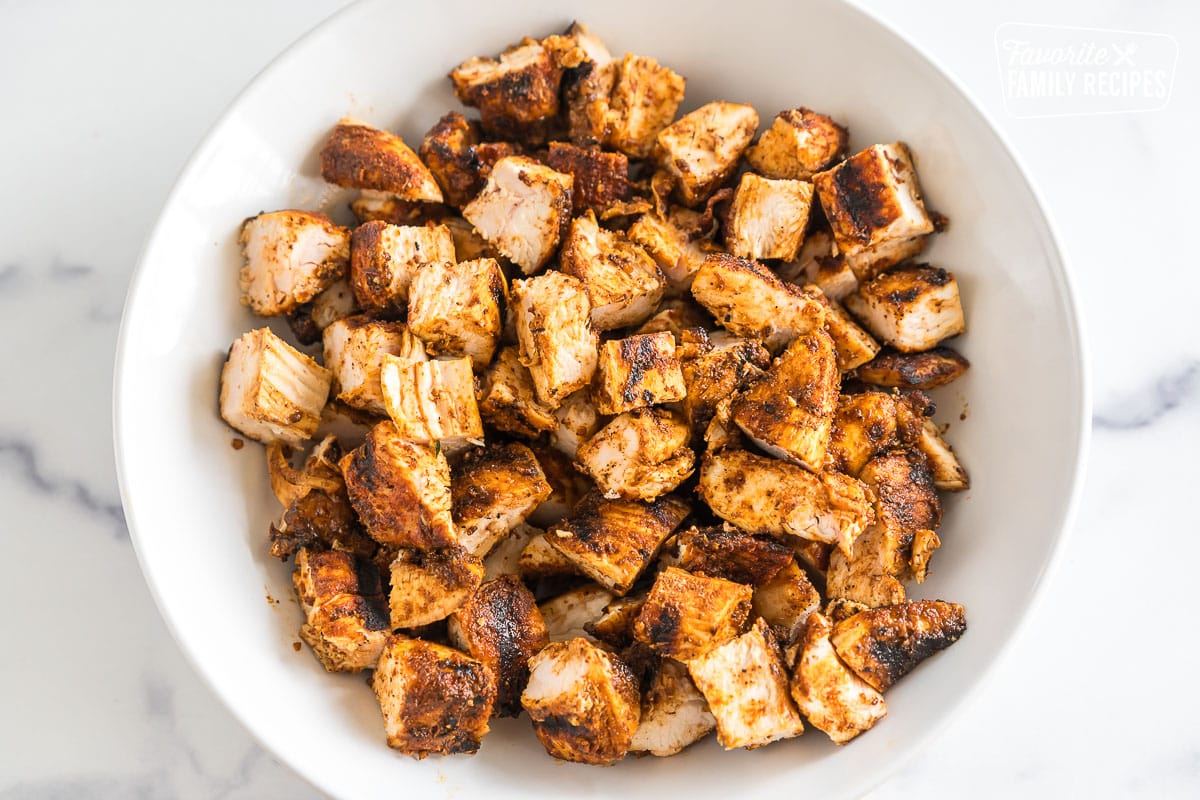 cubed seasoned grilled chicken in a bowl