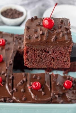 Spatula lifting a slice of Chocolate Cherry Cake.