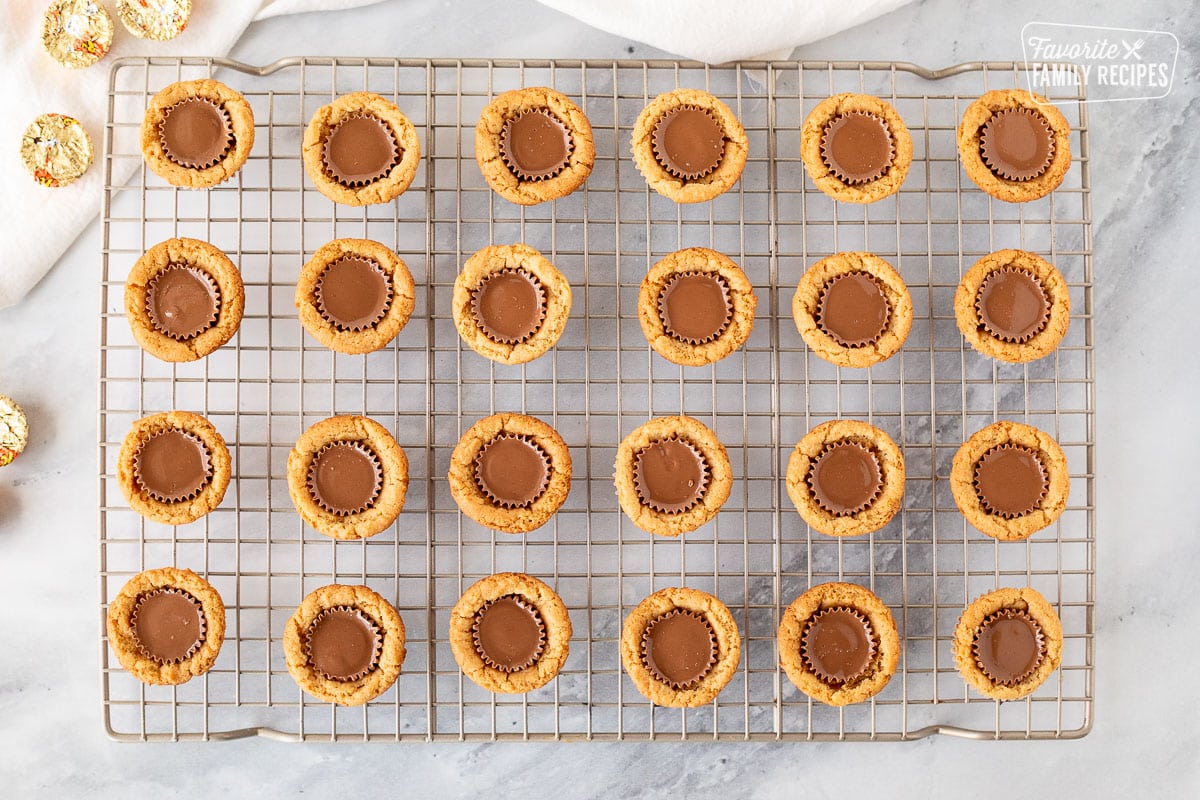 Cooling Reese's Peanut Butter Cup Cookies on a rack.