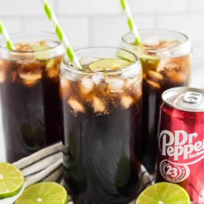Dirty Dr Pepper with lime and a straw
