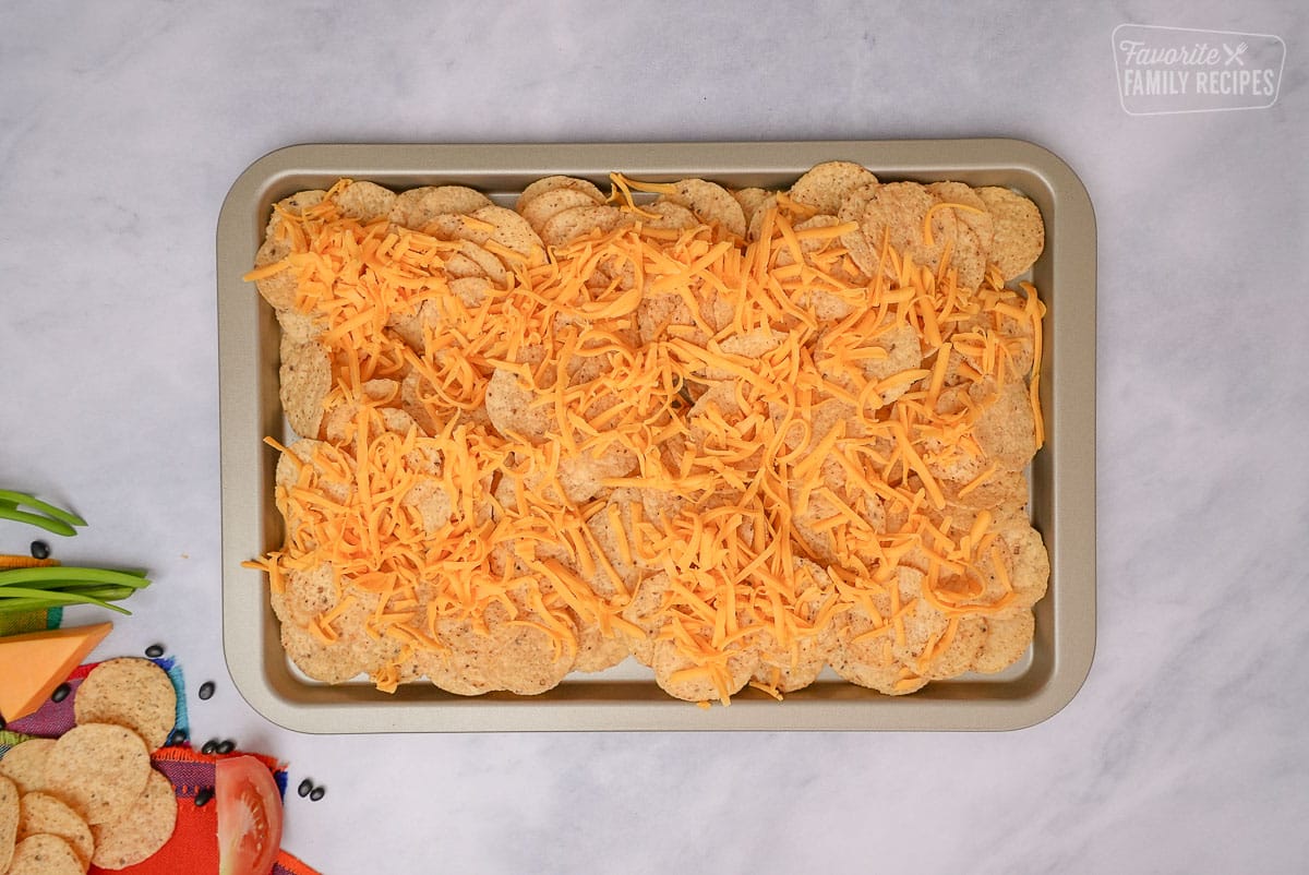 Oven Nachos on a sheet pan with cheese