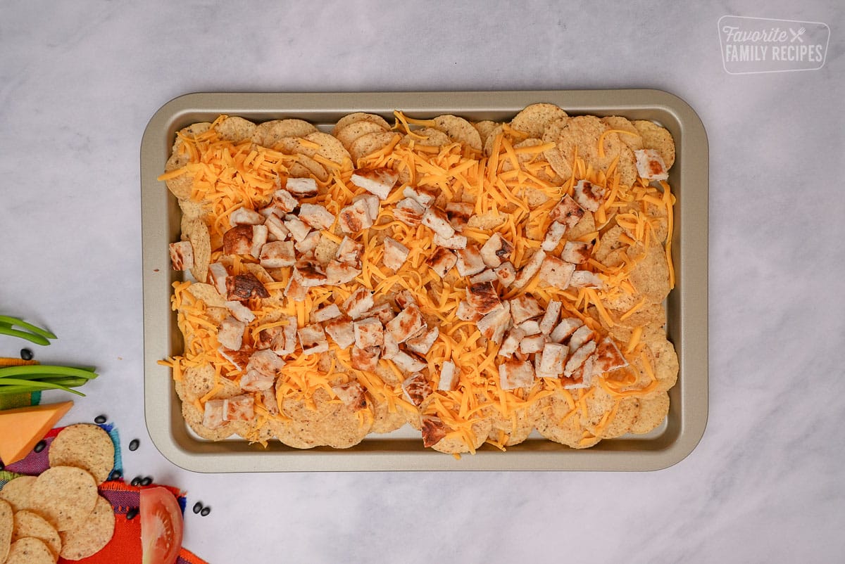 Oven Nachos on a sheet pan with chicken and cheese