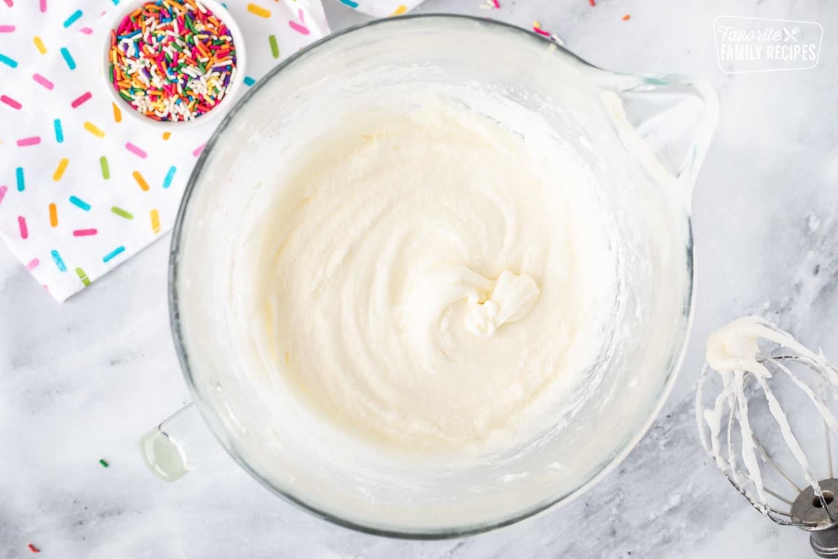 Mixing bowl with white cake batter base.