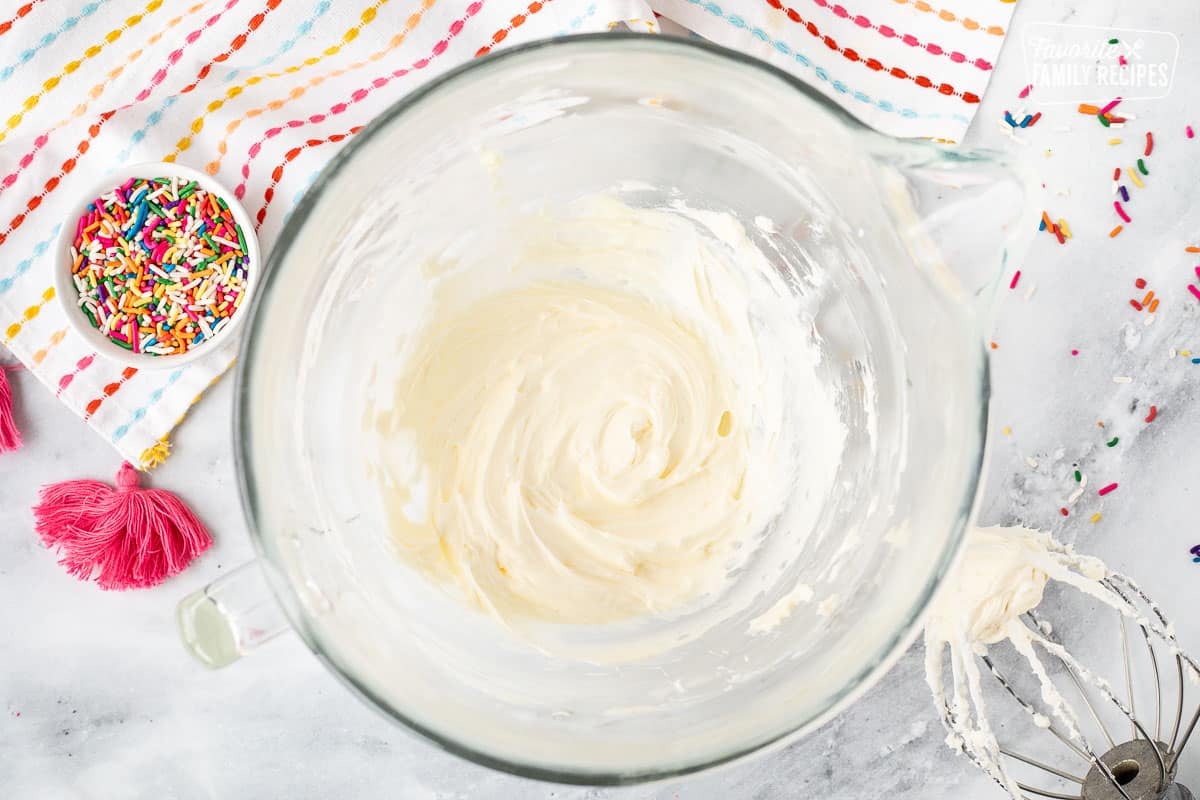 Mixing bowl with creamed butter. Whisk attachment on the side.