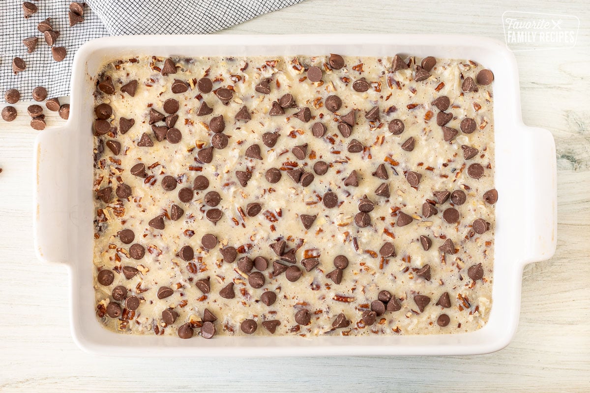 Unbaked German Chocolate Cookie Bars in a baking dish.