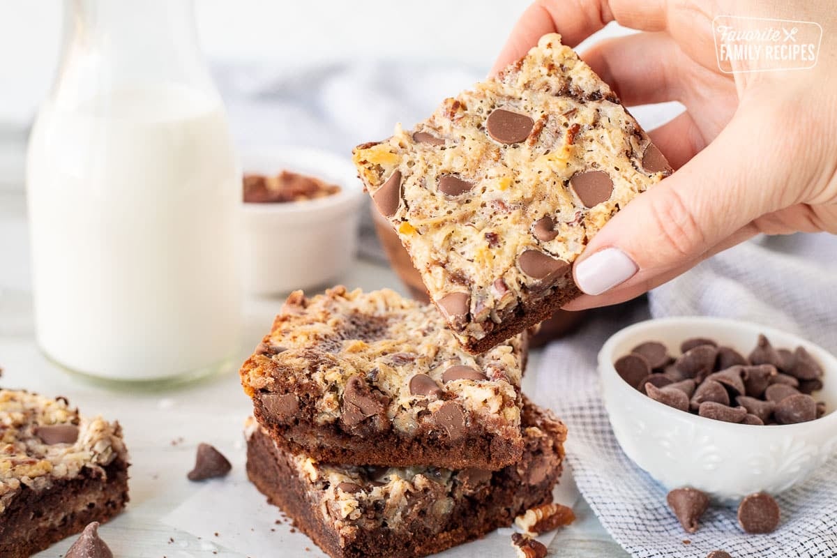 Hand picking up a German Chocolate Cookie Bar.