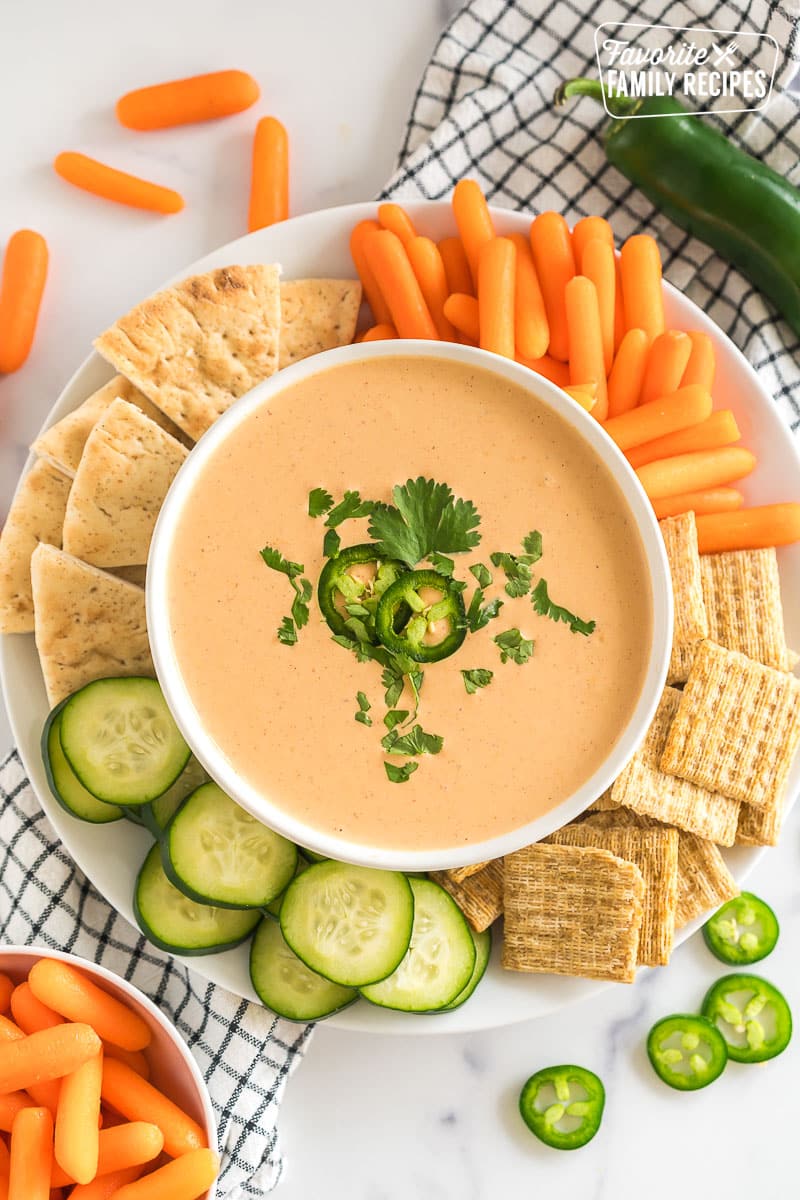 A bowl of Jalapeno Dip with crackers and veggies