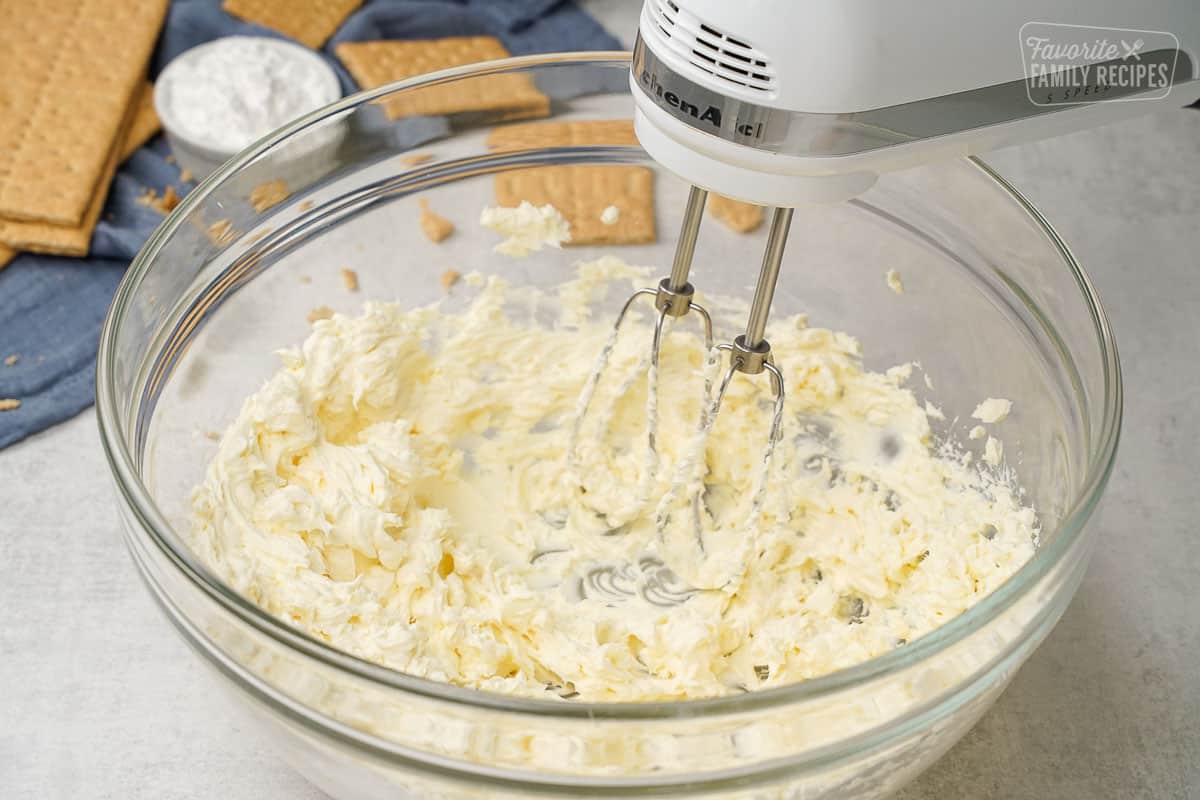 Mixing the cream cheese for no bake cheesecake