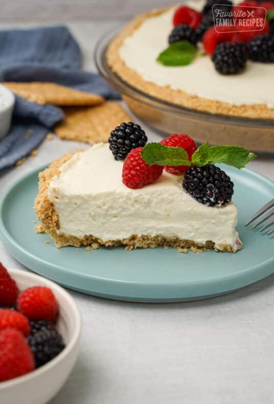 Cheesecake on a blue plate with berries