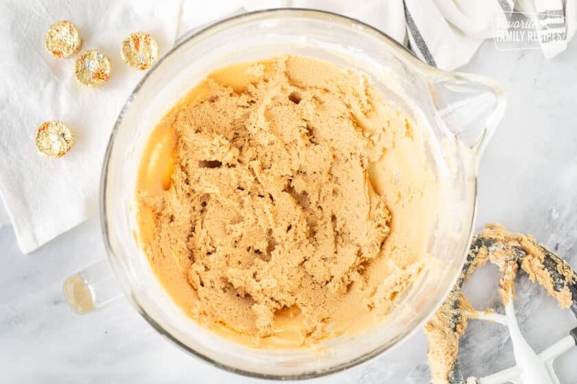 Cookie dough batter for Reese's Peanut Butter Cup Cookies in a mixing bowl.