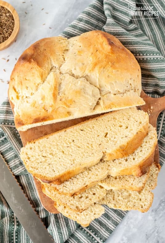 Sliced loaf of Irish Soda Bread and a bread knife.