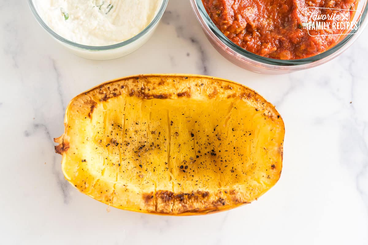 Half of a spaghetti squash cooked and seasoned with salt and pepper