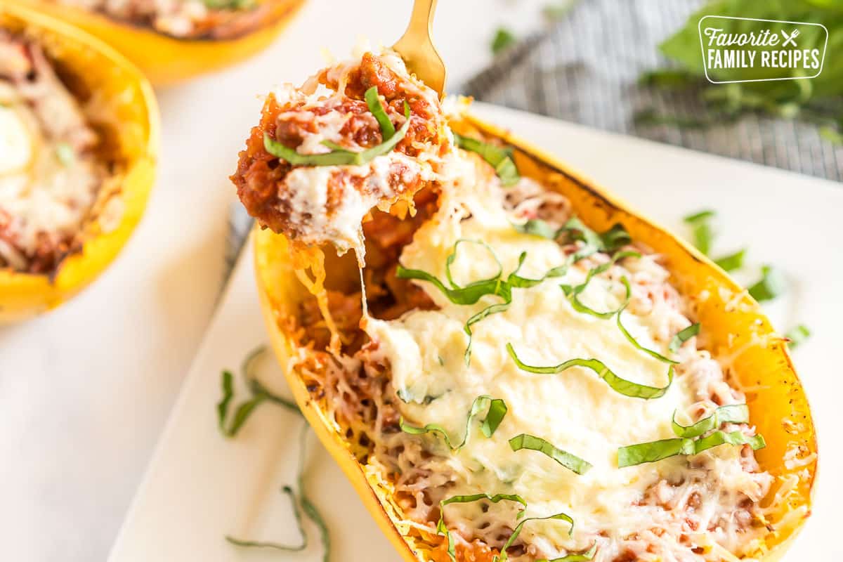 a fork taking a bit of spaghetti squash lasagna