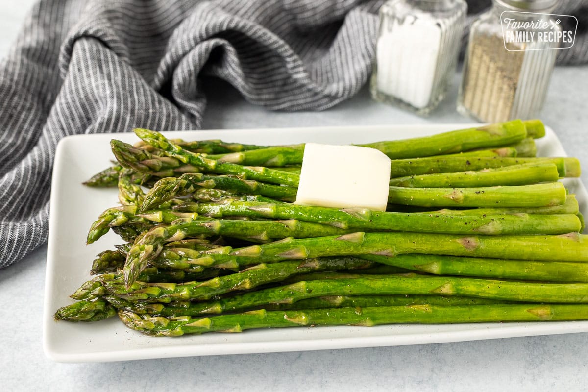 Sweet Sautéed Asparagus on a plate with butter.