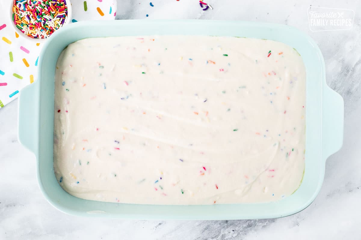 Unbaked Funfetti Cake in a baking dish.