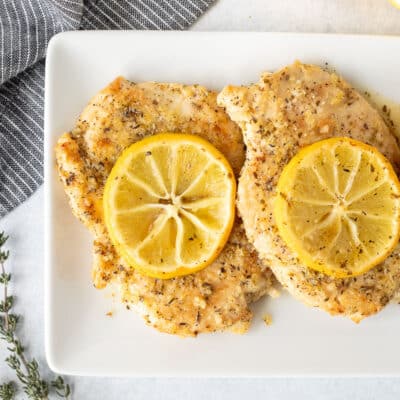 Plate with three Baked Lemon Chicken.