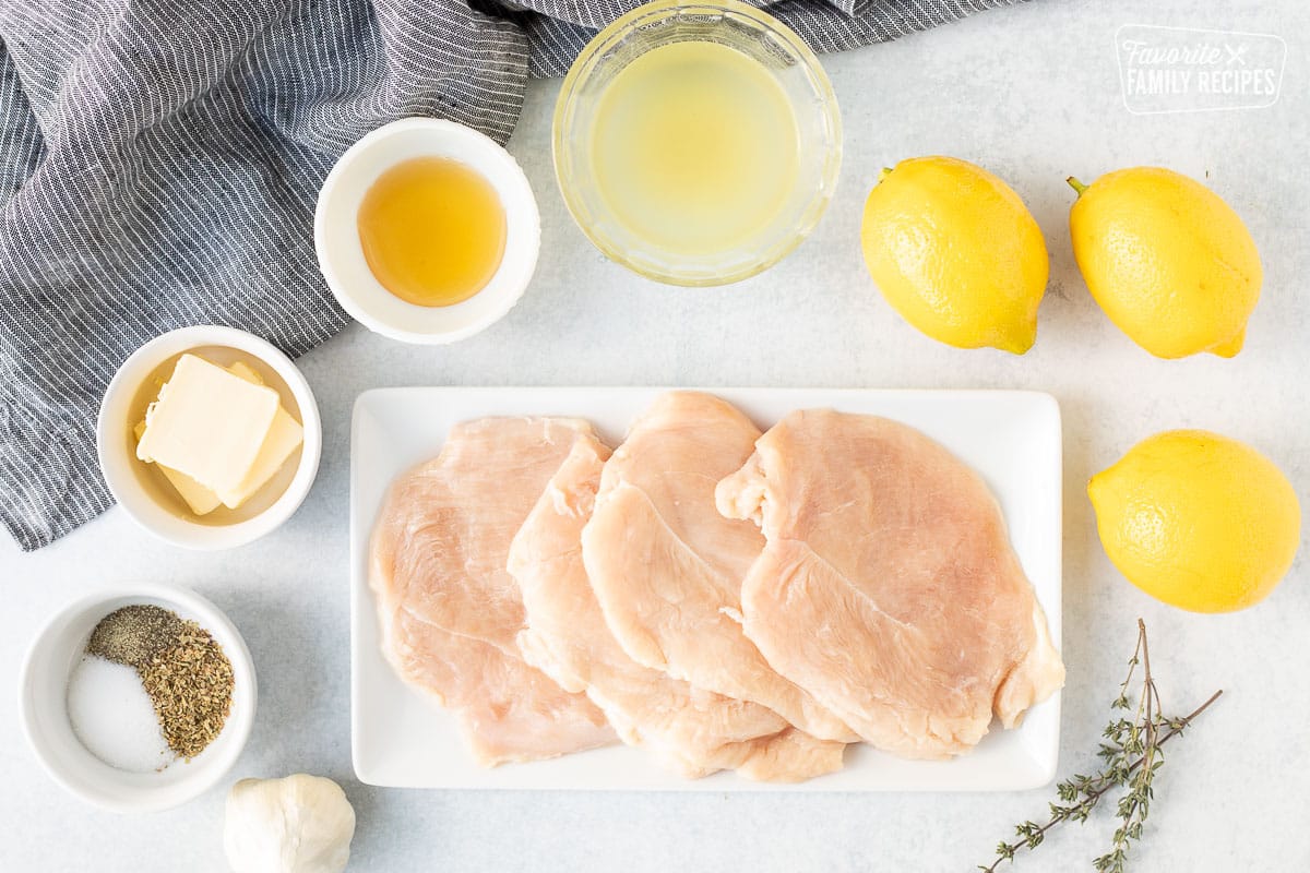 Ingredients to make Baked Lemon Chicken including chicken breasts, lemon, chicken broth, honey, butter, salt, pepper, Italian seasoning and garlic.