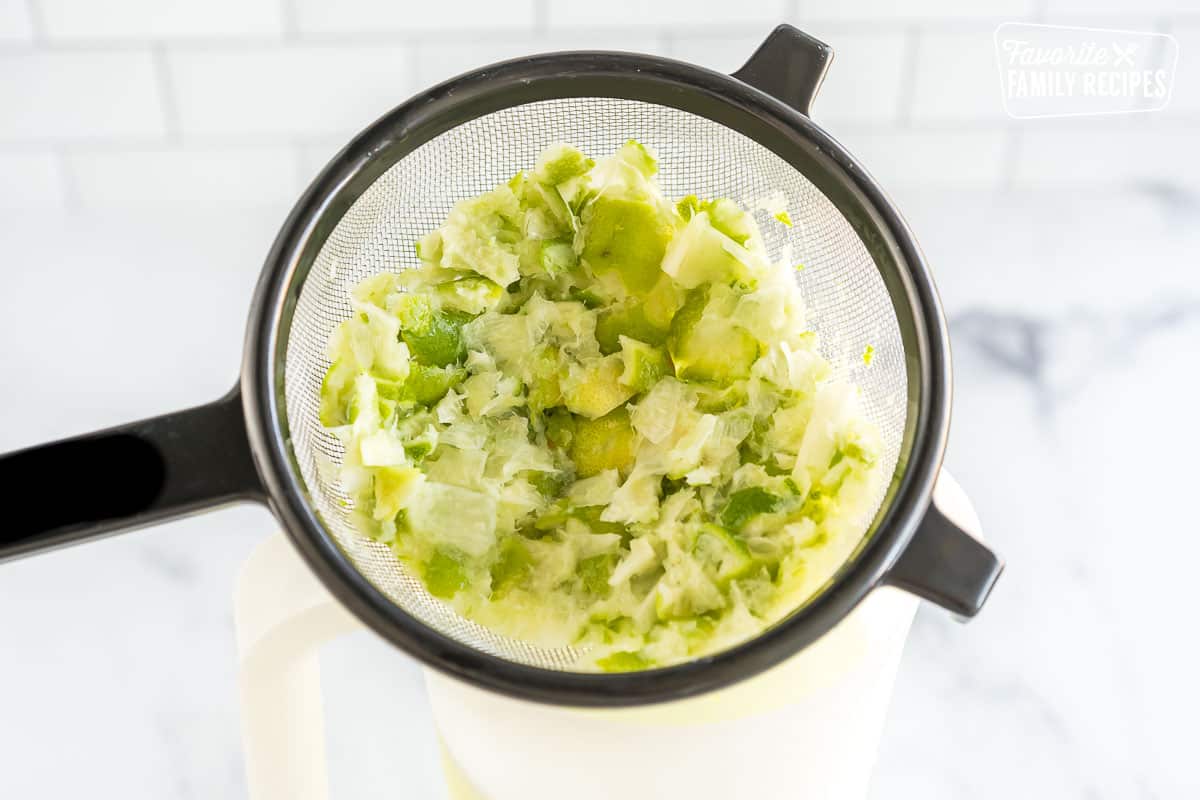 Blended and drained limes in a colander