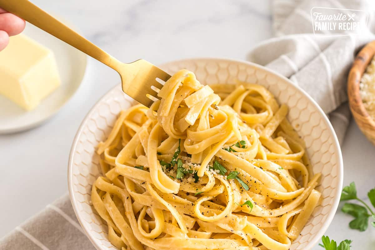 Buttered Noodles being swirled on a fork