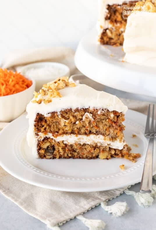 Classic Carrot Cake sliced on a plate with a fork.