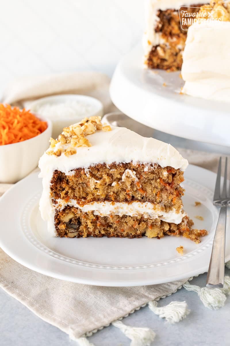 Classic Carrot Cake sliced on a plate with a fork.