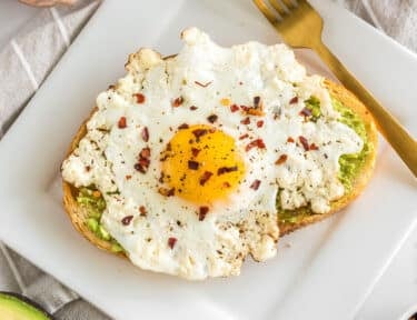 A feta egg on a piece of avocado toast