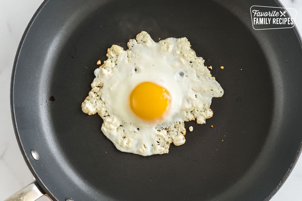 A sunny side up egg cooked with feta
