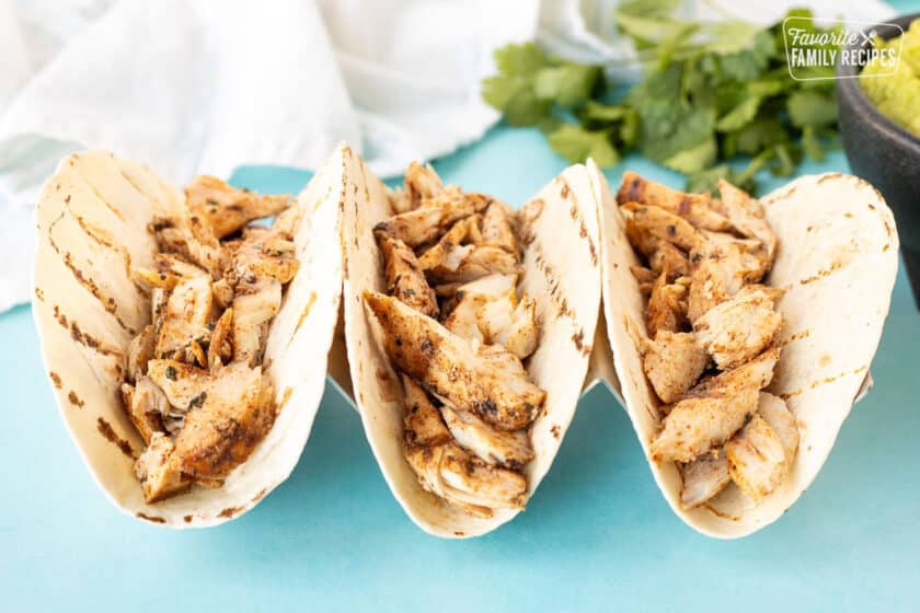 Three flour tortillas with grilled mahi mahi fish.