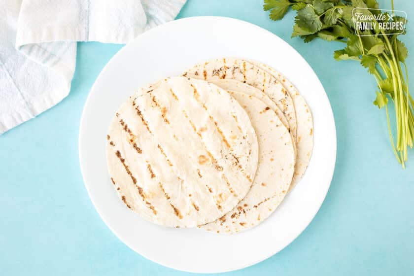 Plate with grilled flour tortillas on a plate.