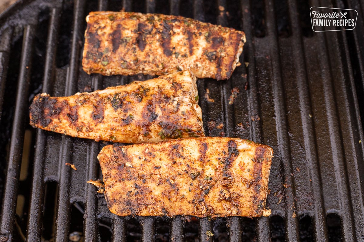 Three fillets of mahi mahi on the barbecue.