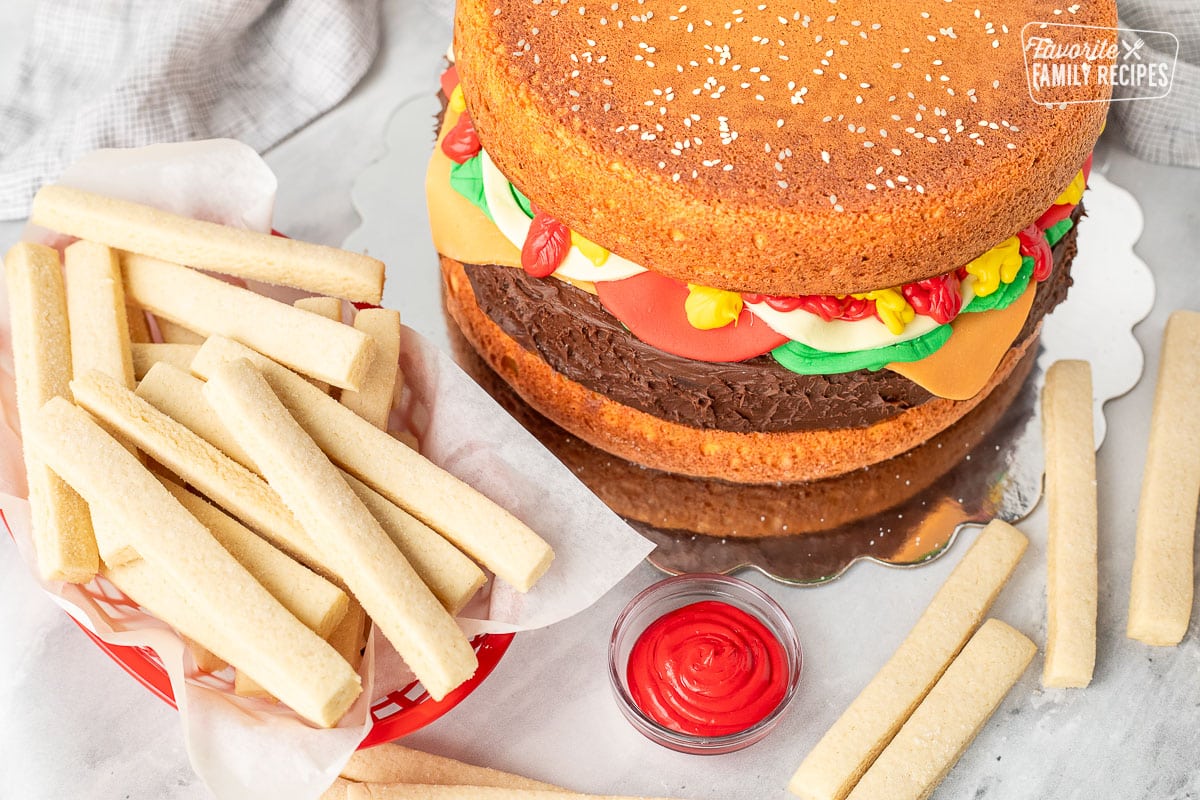 Hamburger Cake with sugar cookie fries and red ketchup.