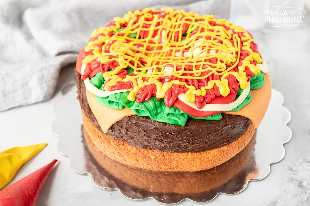 Yellow and red frosting topped on the Hamburger Cake to create a mustard and ketchup look.