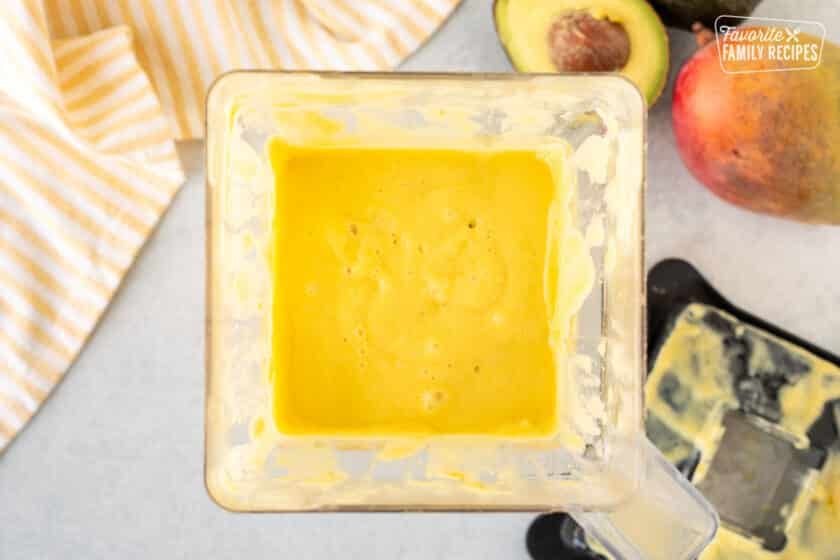 Blender with blended Mango Avocado smoothie blended.